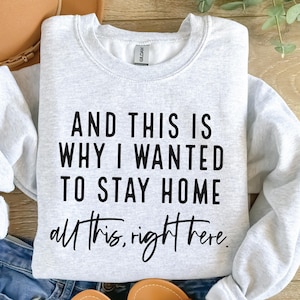 May include: Gray sweatshirt with the text "AND THIS IS WHY I WANTED TO STAY HOME all this, right here."
