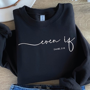 May include: Black sweatshirt with white text that reads "even if" and "DANIEL 3:18".