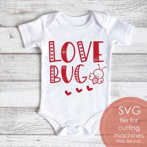 May include: White baby onesie with red text that says "LOVE BUG" with a small red bee illustration. Three small red hearts are below the text.