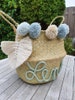 Personalized seagrass basket with bobbleheads and macramé feather 