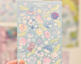 May include: A light blue sticker sheet featuring various cartoon aquatic creatures and the text "Waterman Pals." The sticker sheet has a light blue background with bubbles and leaf-shaped accents. The stickers are in various colors.