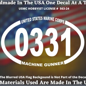 May include: White decal featuring the text "0331" inside a white oval with "UNITED STATES MARINE CORPS" above and "MACHINE GUNNER" below. The decal also includes the text "Handmade In The USA" and "USMC HOBBYIST LICENSE # 563-24".