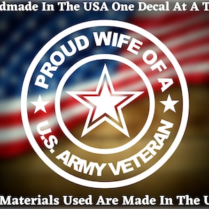 May include: White vinyl decal with a star and the text "Proud Wife of a U.S. Army Veteran" in a circle. The decal is on a blurred background of an American flag.