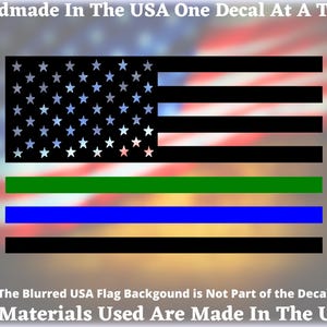 May include: A black and white American flag decal with green and blue stripes. The decal includes the text "Handmade In The USA One Decal At A Time" and "All Materials Used Are Made In The USA".