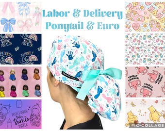 May include: A white surgical scrub cap with a light blue bow, featuring a pattern of handprints and footprints in blue and pink. The text "Labor & Delivery Ponytail & Euro" is visible.