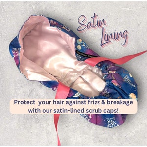 May include: A blue scrub cap with a galaxy print, featuring a satin lining and a pink ribbon tie. The text "Satin Lining" is written in cursive. The text "Protect your hair against frizz & breakage with our satin-lined scrub caps!" is also visible.