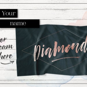 May include: A dark green beach towel with a diamond shape in the center. The word "Diamonds" is written in rose gold inside the diamond.