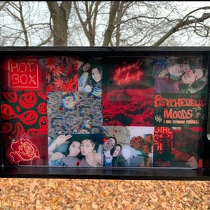 May include: Black rectangular tray with a collage of red and black images, including photos, text, and graphics. The tray features the words "HOT BOX" and "good vibes". The tray has handles on the sides.