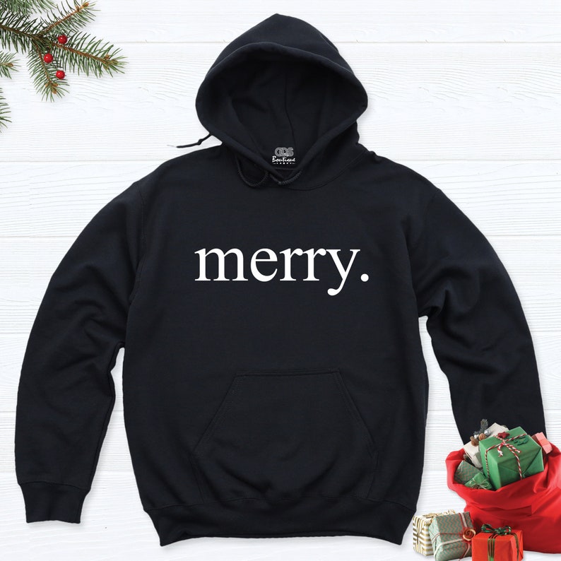 May include: Black hooded sweatshirt with the word "merry" printed in white on the front.