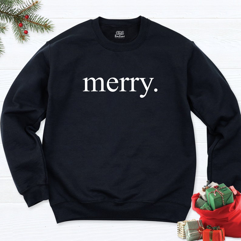 May include: Black sweatshirt with the word "merry." printed in white on the front.