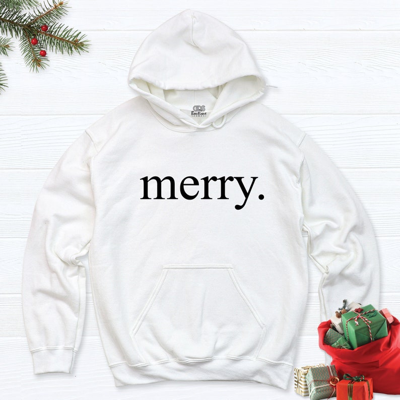May include: White hooded sweatshirt with the word "merry." printed in black on the front.