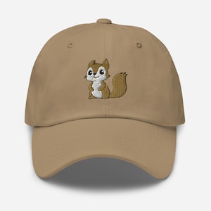 May include: A brown baseball cap with an embroidered cartoon squirrel design. The squirrel is brown with a white belly and a bushy tail.