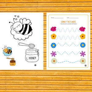 May include: A black and white line drawing of a bee sleeping in a cloud. Below the bee is a jar of honey with a dipper. The text "HONEY" is written on the jar. A printable worksheet with a bee and honey theme.