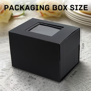 May include: Black rectangular packaging box with a clear window on top. The box measures 10 cm long, 7.5 cm wide, and 7 cm high (approximately 3.9 x 3 x 2.8 inches). The text "PACKAGING BOX SIZE" is at the top.