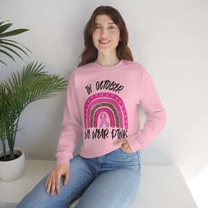 In October We Wear Pink Unisex Heavy Blend Crewneck Sweatshirt, Warrior Shirt, Pink Ribbon Cancer Awareness Sweatshirt, Rainbow Shirt