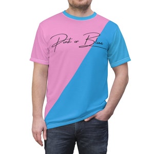 May include: A pink and blue t-shirt with the text "Pink or Blue" in black script.