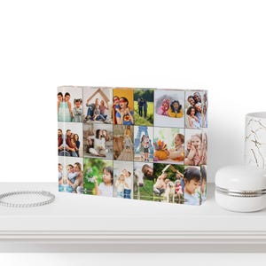 May include: A collage of 25 photos printed on a clear acrylic block. The photos feature a variety of people, including families, couples, and children. The photos are arranged in a grid pattern and are printed in color.