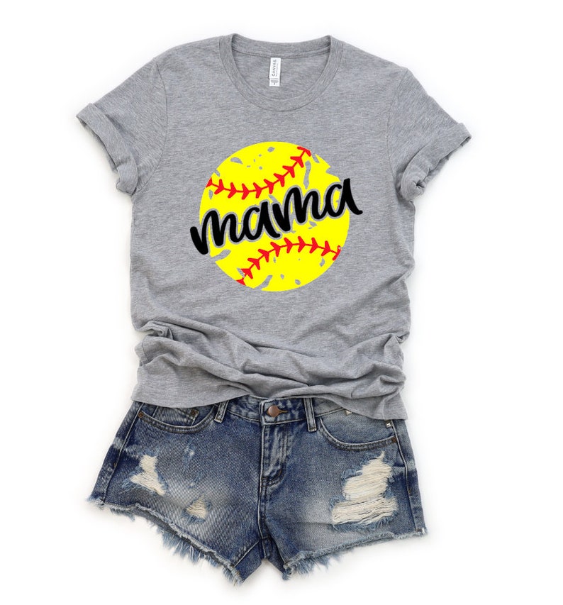 May include: Gray t-shirt with a yellow softball graphic and the word "mama" in black lettering.