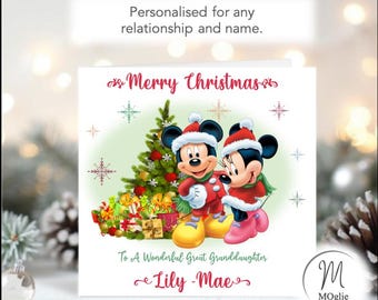 May include: A square Christmas greeting card featuring Mickey and Minnie Mouse wearing Santa hats and scarves next to a decorated Christmas tree with gifts. The text reads Merry Christmas, To A Wonderful Great Granddaughter, and Lily-Mae.