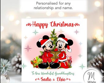 May include: A square Christmas greeting card featuring Mickey and Minnie Mouse wearing Santa hats and red outfits, singing from a book in front of a Christmas tree. The text reads Happy Christmas, To Our Wonderful Granddaughters, Sadie & Elsie.