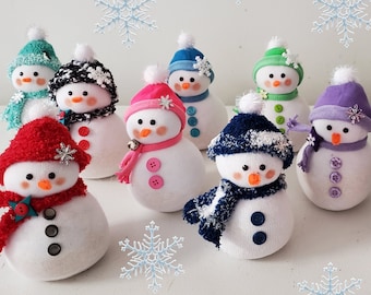 Adorable hand crafted Snowmen. Each has their own unique personality. Great decor for Christmas and Winter. They make a fun gift for all!