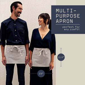 Stylish waist apron for servers, durable canvas fabric, adjustable waist strap, functional pockets for utensils, ideal for waitstaff and bartenders, enhances professionalism, perfect for restaurants and cafes