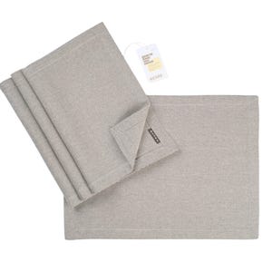 May include: Set of four gray linen placemats with a subtle texture. The placemats are folded and stacked, with a tag that reads "Easy to wash, easy to style" attached to the top.