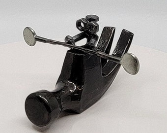 Handmade Hammer Kayaker Sculpture: Unique Metal Art