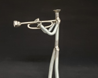 Welded metal nuts and bolts trumpet player