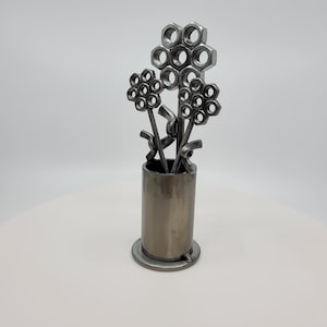 Metal vase with three nuts and bolts style welded flowers image 5