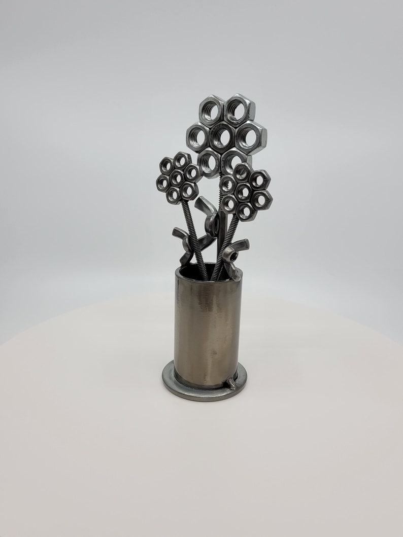 Metal vase with three nuts and bolts style welded flowers image 5