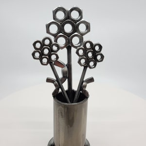 Metal vase with three nuts and bolts style welded flowers image 2