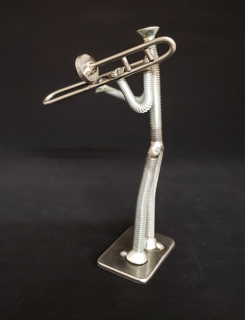 Welded metal nuts and bolts trombone player
