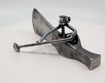 Repurposed Tomahawk Canoe Sculpture: Handmade Metal Art