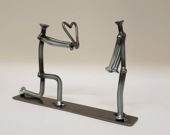 Welded nuts and bolts style romance scene