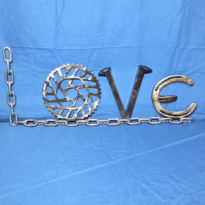 Welded Repurposed Metal "Love" Sign v1