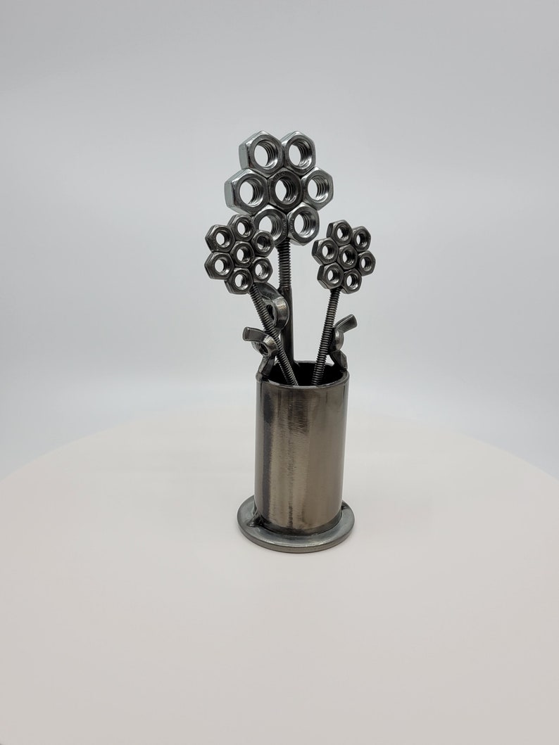 Metal vase with three nuts and bolts style welded flowers image 4