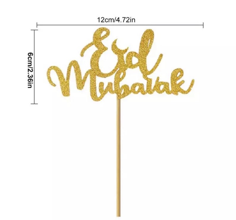 May include: Gold glitter cake topper with the words "Eid Mubarak" on a wooden stick. The topper is 4.72 inches wide and 2.36 inches tall.
