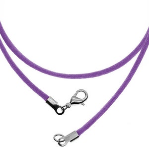 May include: A purple cord necklace with a silver lobster clasp.