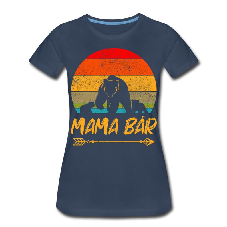 May include: A navy blue t-shirt with a retro sunset graphic featuring a mama bear and her cubs. The text "MAMA B&Auml;R" is printed in yellow below the graphic.