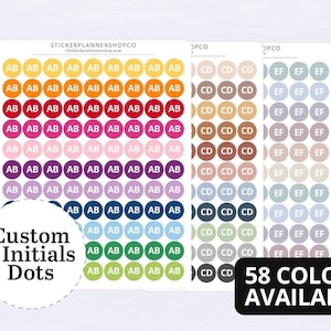 May include: Three sheets of circular adhesive stickers featuring two-letter initials. The first sheet displays rows of yellow, orange, red, pink, purple, blue, and green dots labelled AB. The other sheets show neutral-toned dots labelled CD and EF.