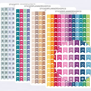 May include: Three sheets of colourful planner stickers with numbers 1 through 31 and a star for the 16th. The stickers are in a rainbow pattern with each number having a different colour. The stickers are in the shape of flags.