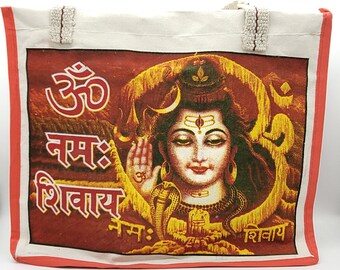 May include: A canvas tote bag featuring a detailed illustration of a deity with the text "Om Namah Shivaya" in red and gold. The bag has a white body with red trim and decorative handles.