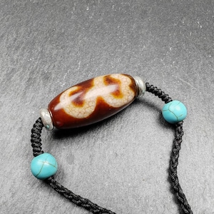 Tibetan Fire Agate Lotus Dzi Necklace: Protective Charm