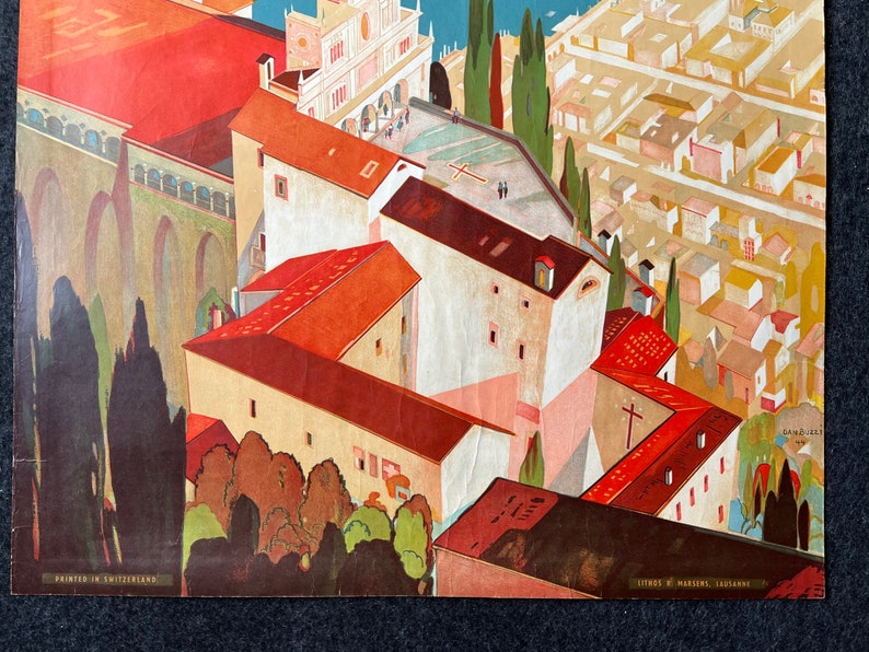 May include: A vintage illustration of a city scene with red-roofed buildings, a central square, and a church with a cross on the roof. The buildings are painted in a stylized, geometric style, with a focus on the architectural details. The illustration is set against a background of a blue sky and green trees.