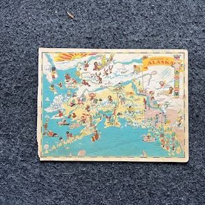 Mapa ilustrado de ALASKA de 1931, página original del Atlas, arte de cabaña, decoración de pared vintage, estilo occidental coleccionable, obsequios de cómic