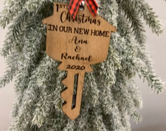 Personalized Christmas ornament “Our first Christmas in our new home”. Customized wooden ornament featuring your names and the current year