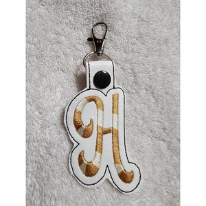 Chaveiro com inicial H, pingente para bolsa, etiqueta de bolsa, monograma, letra, dourado e branco