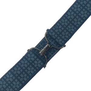 May include: A blue elastic suspender with a geometric pattern and a silver-tone metal clasp. The suspender is angled diagonally against a white background, showcasing its design and construction.