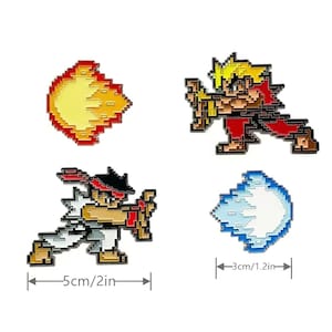 May include: Four enamel pins featuring pixelated characters from a video game. The pins are red, yellow, blue, and white. The pins are approximately 2 inches and 1.2 inches in size.